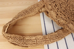 Close-up of hand-woven hollow paper rope shoulder bag featuring soft inner fabric lining