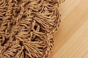 Detailed macro view of hollow paper rope woven texture with interior fabric lining