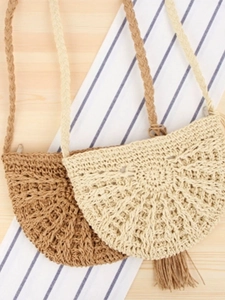 Handmade woven semi-circle crossbody bag with tassel detail for beach vacation