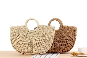 Close-up of semi-circle woven paper rope bags with hollow mesh and fabric lining