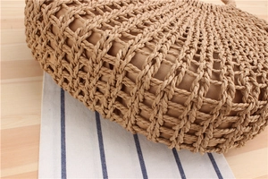 Close-up of hand-woven hollow paper rope beach bag with internal fabric lining