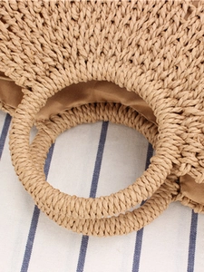 Minimalist hand-woven paper rope beach bag with round handles and beige lining