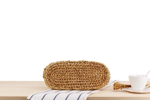Macro shot of the oval woven base with metallic gold finish and spiral hand-knit texture