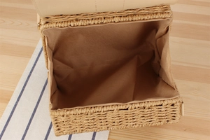 Top view of handwoven paper straw bag showing spacious interior with brown lining