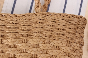 Close-up of dual-texture paper rope weaving on a natural brown minimalist shoulder bag