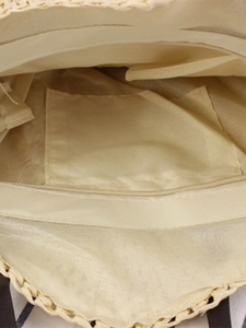 Vue intérieure du sac bandoulière rond en corde de papier avec doublure et poche zippée