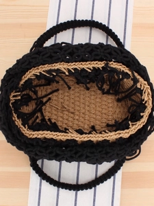 Handmade hollow woven tote bag with round handles and contrasting interior lining