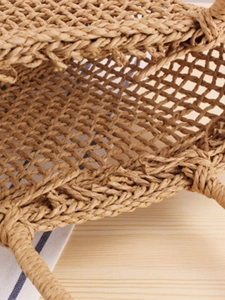 Ins style hollow woven handbag in natural straw color for summer beach and daily casual use