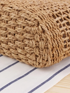 Handwoven straw tote bag with hollow knit design for beach vacation and daily casual use