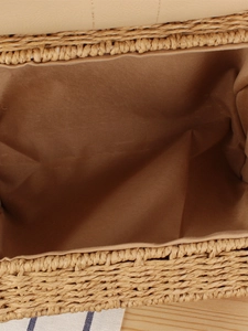Top view of handmade woven paper rope handbag showing spacious brown fabric interior