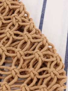 Handmade woven cotton rope beach bag with boho net pattern and rattan handle
