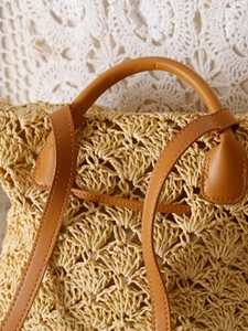 Handwoven straw backpack with openwork pattern and vintage brown leather straps