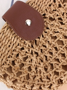 Minimalist handmade hollow woven shoulder bag with brown leather strap and silver buckle