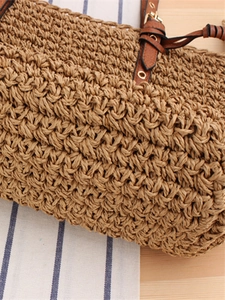 Handmade woven paper rope shoulder bag with tassel details and leather straps for beach
