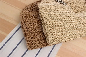 Detail showing handcrafted mesh knit texture of brown and beige woven summer beach bags