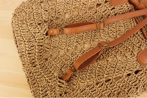 Macro detail of paper rope woven texture and adjustable PU leather straps on backpack