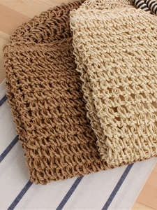Handwoven straw tote bag in dark brown and cream white for summer beach style