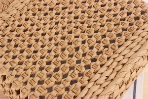 Detailed macro view of khaki paper rope woven bag showing intricate openwork lattice pattern