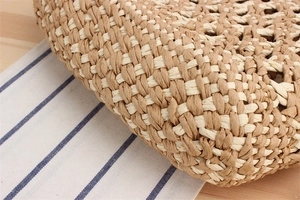 Detail shot of the two-tone paper rope weave texture on a bohemian beach shoulder bag