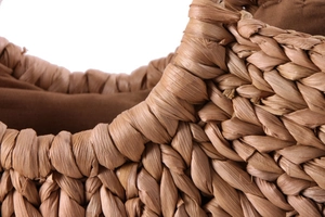 Close-up of thick woven corn husk material with durable brown inner fabric lining