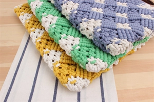 Close-up of cotton rope woven pattern with wooden handle on a plaid handbag