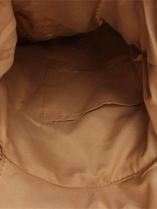 Women's forest woven straw backpack with brown fabric lining and inner slip pocket detail