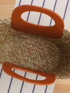 French style woven straw handbag with orange brown handles for summer travel and commuting