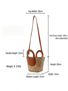 Minimalist woven straw bucket bag with brown leather handles and dimension details