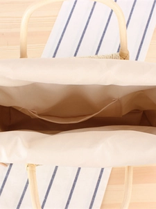 Minimalist paper rope woven beach bag with bamboo handles and fabric lining