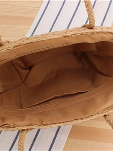Minimalist straw woven shoulder bag with zipper closure and natural light brown texture