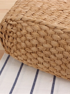 Minimalist straw woven shoulder bag with intricate paper rope texture in natural wood tone
