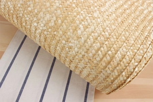 Detail shot of the high-quality hand-woven straw material and texture of the summer bag