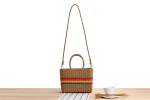 Detail of colorful rainbow stripes and texture on the paper rope woven beach bag