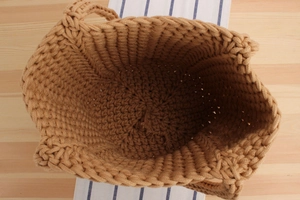 Top view of handmade woven cotton rope bucket bag with thick handles and large capacity