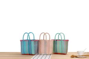 Three-piece colorful woven basket set in macaron tones for picnic and storage