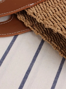 French style straw woven tote bag with brown leather handle and white stitching details