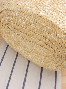 Handwoven straw tote bag with natural fiber texture for summer beach and daily leisure use