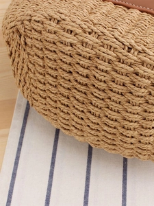 French style woven straw tote bag with brown leather trim and detailed stitching texture