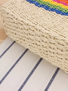 Handcrafted woven paper straw crossbody bag with colorful rainbow stripes for beach vacations