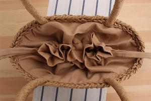 Detail of hand-woven paper rope bag with cotton lining and drawstring closure interior