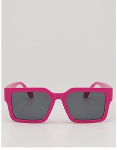 Close-up of pink oversized square sunglasses with thick resin frame and dark grey lenses