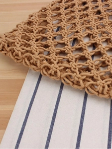 Handcrafted hollow knit shoulder bag in brown cotton rope with a rustic mesh pattern