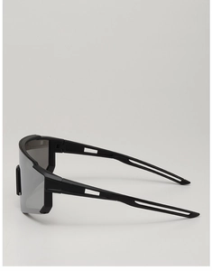 Side view of matte black kids sports sunglasses with grey panoramic lens and hollow temples