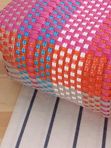 Handmade woven plastic tote bag with colorful patchwork design for beach and picnic use
