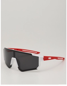 Detail of kids sports sunglasses with red and white frame and large shield lens