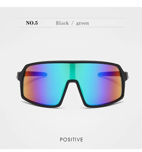 Close-up of kids cycling sunglasses with black frame and colorful gradient one-piece lens