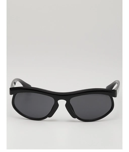 Front detail of trendy kids sunglasses featuring wavy black frames and dark lenses