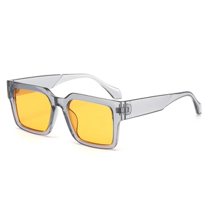 Retro square sunglasses with thick gray transparent frames and bright yellow lenses