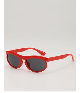 Detail view of vibrant red full-frame children's sunglasses with dark lenses on grey background