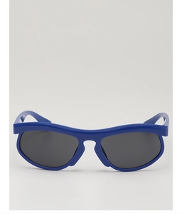 Detailed close-up of blue sports sunglasses with dark grey lenses and high-gloss frames